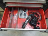 a tool box with tools in it and a cell phone in it