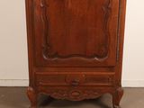 an old wooden cabinet with a mirror on top of it