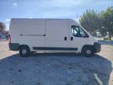 a white van that is parked in a parking lot