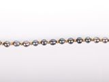 a close up of a gold and black beaded bracelet