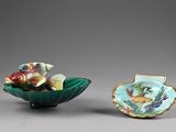 pair of chinese porcelain bowls with fish and flowers on them
