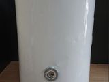 a water heater sitting on a wooden table