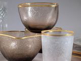 three bowls and two cups sitting on a table