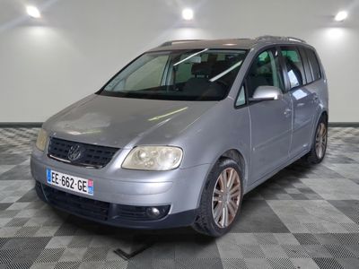 a picture of a silver van parked in a garage