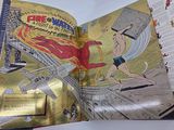 an open book with a picture of a man on a surfboard