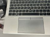 a laptop computer sitting on a desk with a mouse