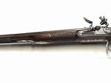 an image of a gun that is on a white surface