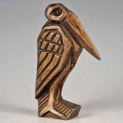 an image of a statue of a bird on a white surface