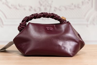 a close up of a handbag on a wooden table