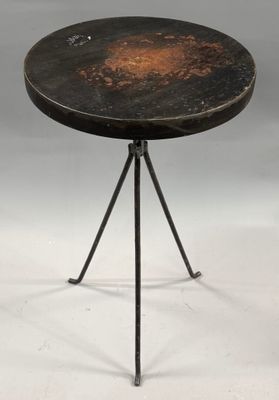 a black table with a metal base and a black top