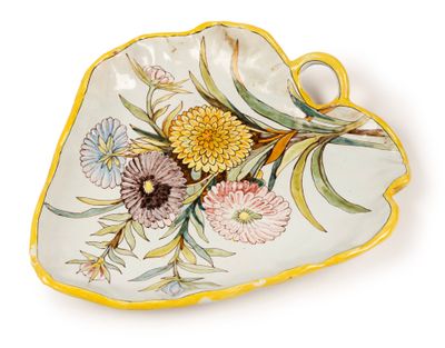 an image of a yellow and white plate with flowers on it