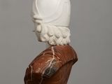 marble bust of a man with a helmet on top of his head