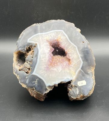 a picture of a piece of rock with a pink center