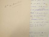 a piece of paper with writing on it sitting on a table