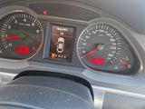 a close up of a car dashboard with various gauges