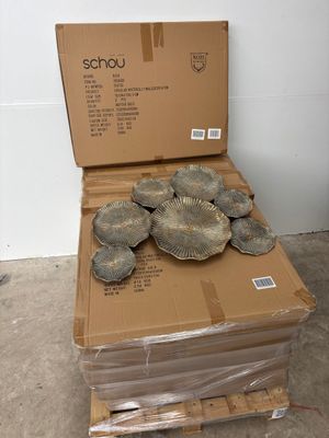 a cardboard box with a bunch of plates on top of it