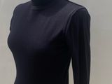black turtle neck top on a mannequin mannequin mannequin mannequin mannequin mannequin mannequin mannequin manne