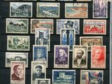 a picture of a collection of stamps on a black board