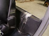 a close up of a car door handle with a piece of tape on it
