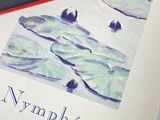 a picture of a book with a picture of water lillies on it