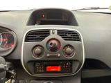 the dashboard of a small car with a clock on the dash