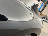 a close up of a car ' s front bumper with a hole in it