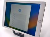 tablet computer sitting on top of a table with a tablet screen on top of it