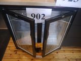 a glass door that is open on a wooden floor