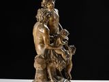 bronze statue of a man and a dog on a marble base