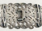 a silver buckle that has a metal buckle on it