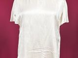 a woman ' s white shirt with a collar on a mannequin