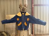 a mannequin of a man wearing a blue jacket and a hat