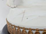 a close up of a statue of a person on a pedestal