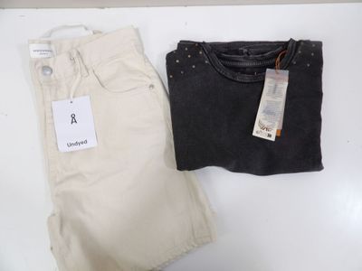 pair of men ' s khaki pants and a t - shirt on a white table