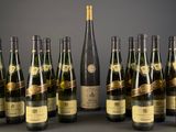 several bottles of wine are lined up on a table