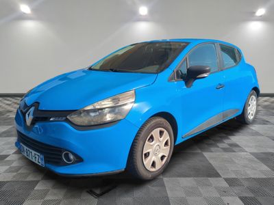 a blue car is parked in a room with a checkered floor