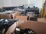 many boxes of assorted electronic equipment in a warehouse