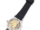 a close up of a watch with a black strap on a white surface