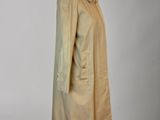 an image of a beige coat on a mannequin mannequin