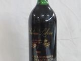 a bottle of wine that is sitting on a table