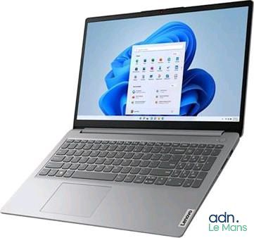 l'ordinateur portable est ouvert sur une surface blanche avec un fond bleu