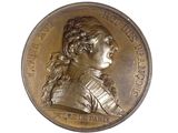 an image of a bronze medal with a woman ' s face on it