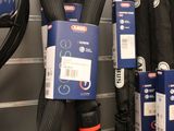 a lot of umbrellas hanging on the wall in a store