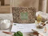 the contents of a spa package are laid out on a marble table