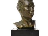 bronze bust of a young man on a marble base