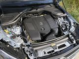 the engine of a car with its hood open on the road