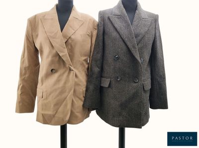 two jackets on a mannequin stand on a white background