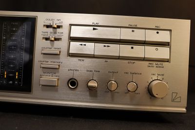 a silver radio that is sitting on a table
