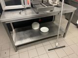 a microwave oven sitting on top of a table in a kitchen