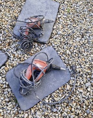 three pairs of shoes that are laying on the ground